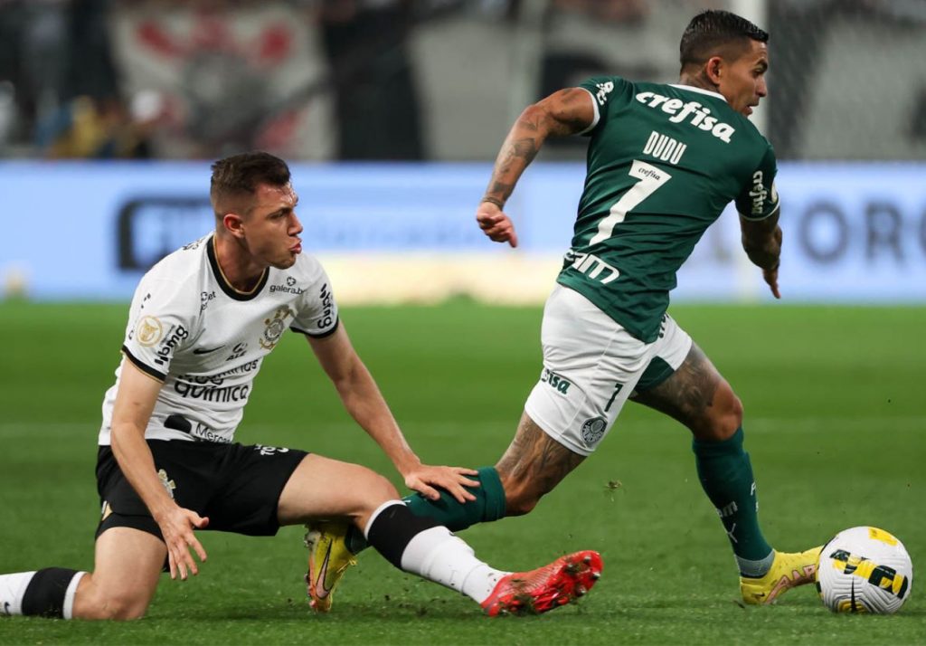 Rafael Navarro of Palmeiras competes for the ball with Claudinho